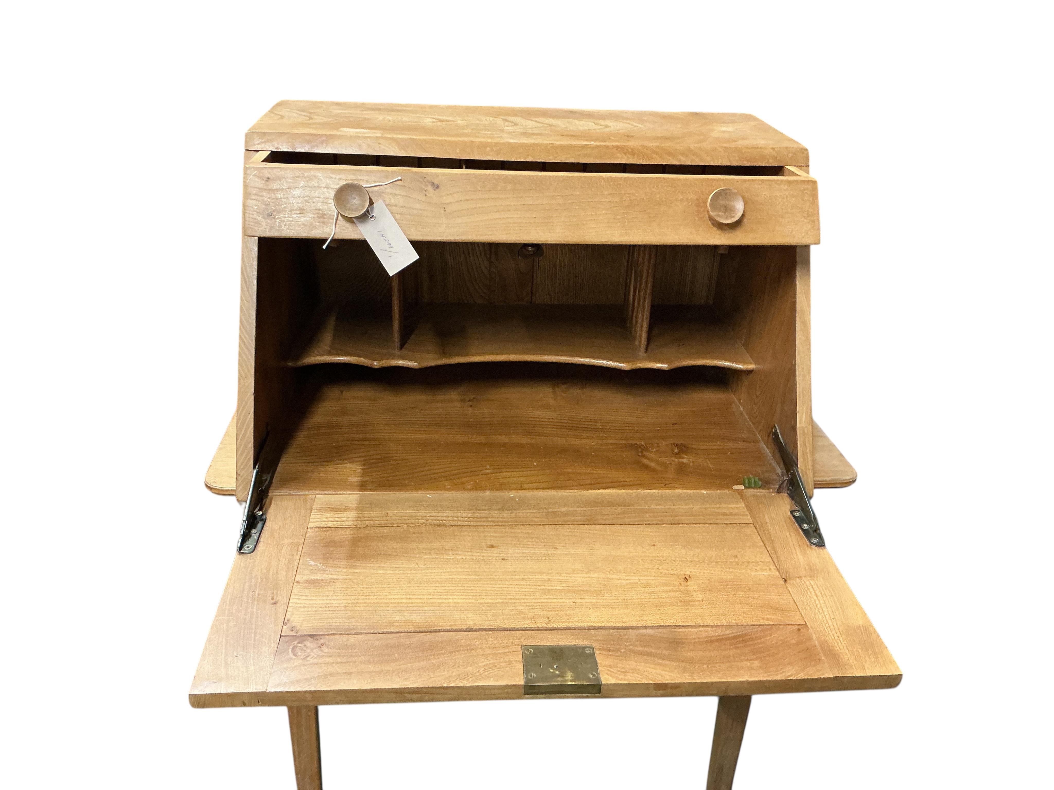 An Ercol elm writing cabinet, width 83cm, depth 42cm, height 37cm